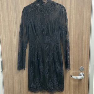 Nikibiki Black Lace dress with floral detail.